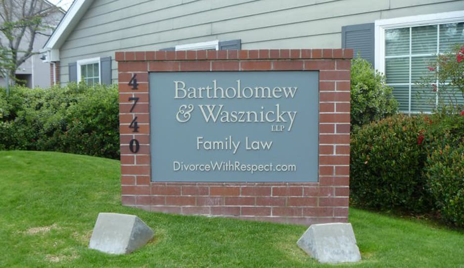 Office sign: Bartholomew & Wasznicky LLP, family law, DivorceWithRespect.com